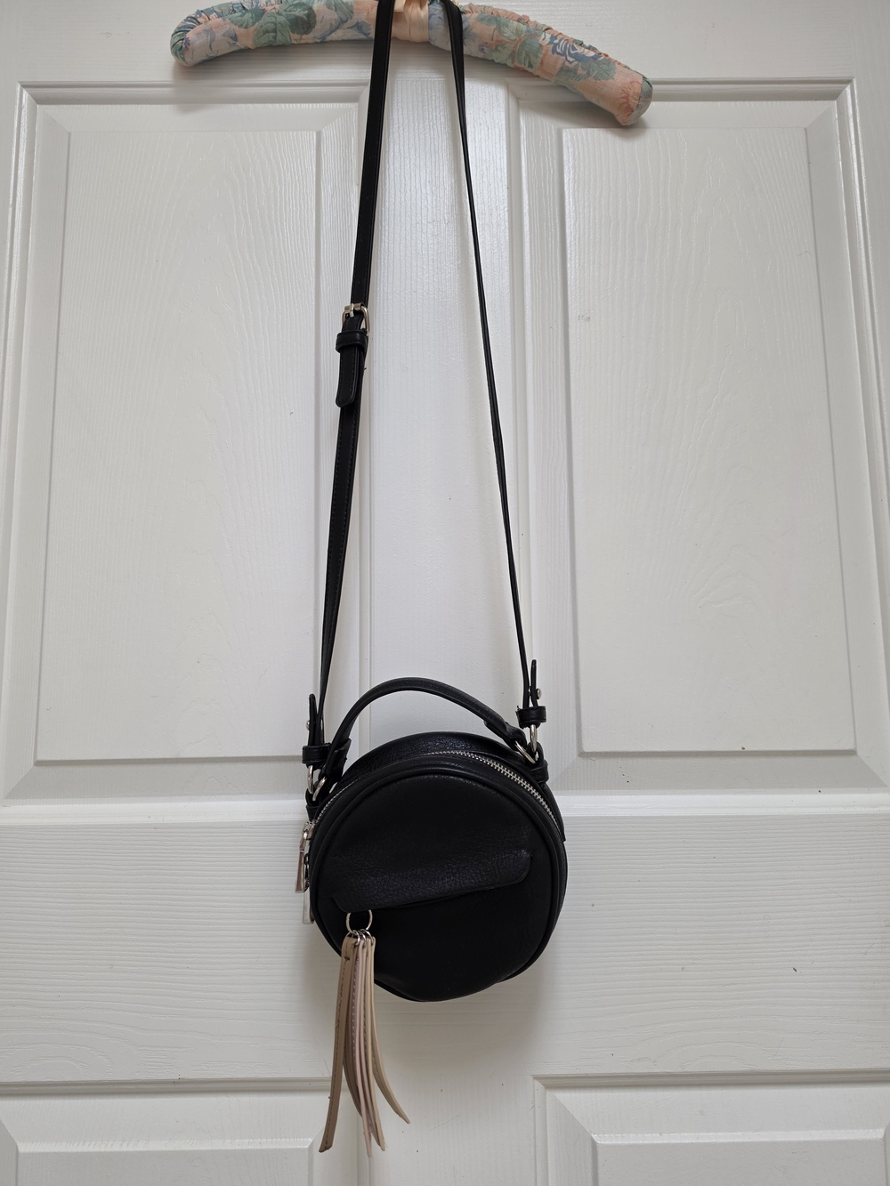 Classic Black Round Crossbody Bag with Tassel Accent